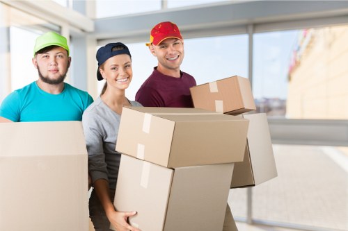 Packed moving boxes and furniture ready for temporary storage in Burntoak